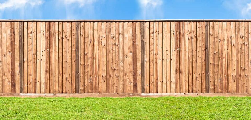 Wooden fence at the grass
