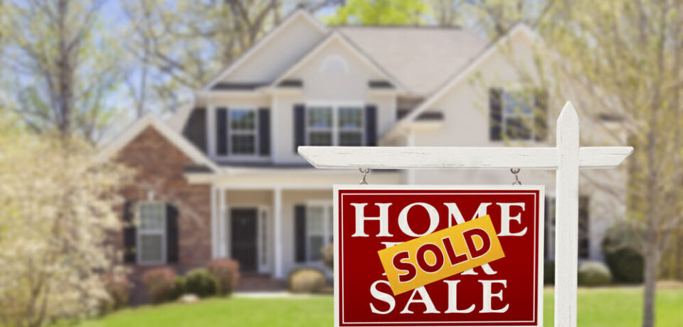 Sold Home For Sale Real Estate Sign and Beautiful New House.